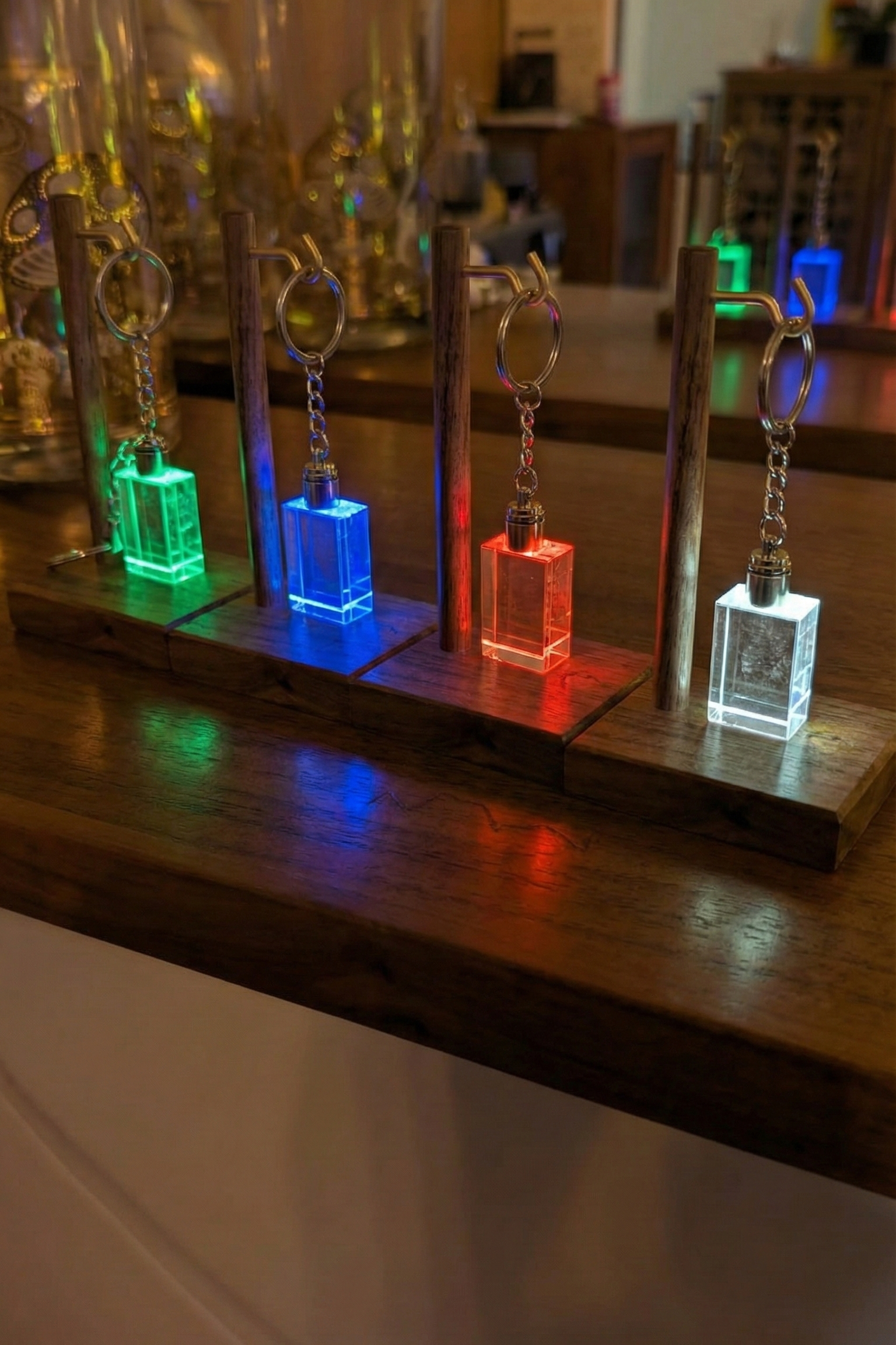 Colorful keychains on a wooden stand with a blurred background